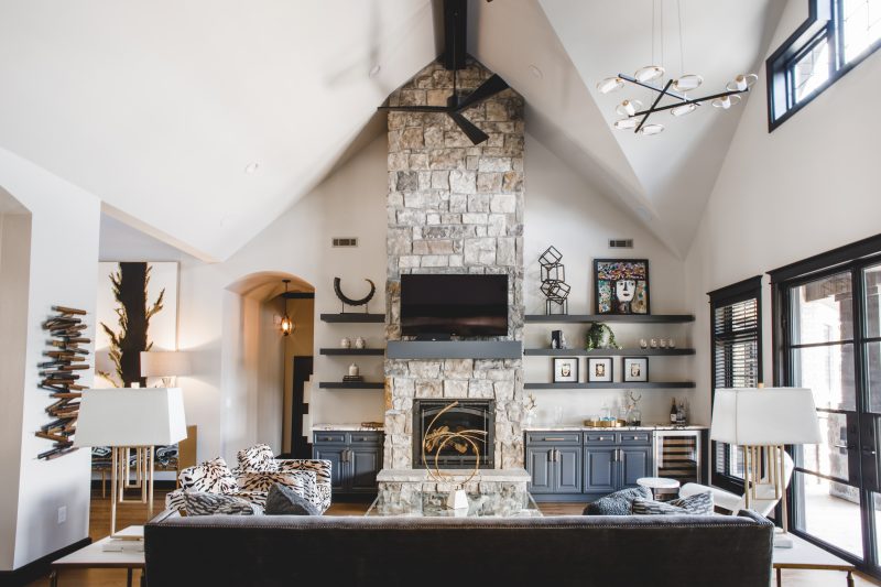 Vaulted great room with stone fireplace and custom built-ins