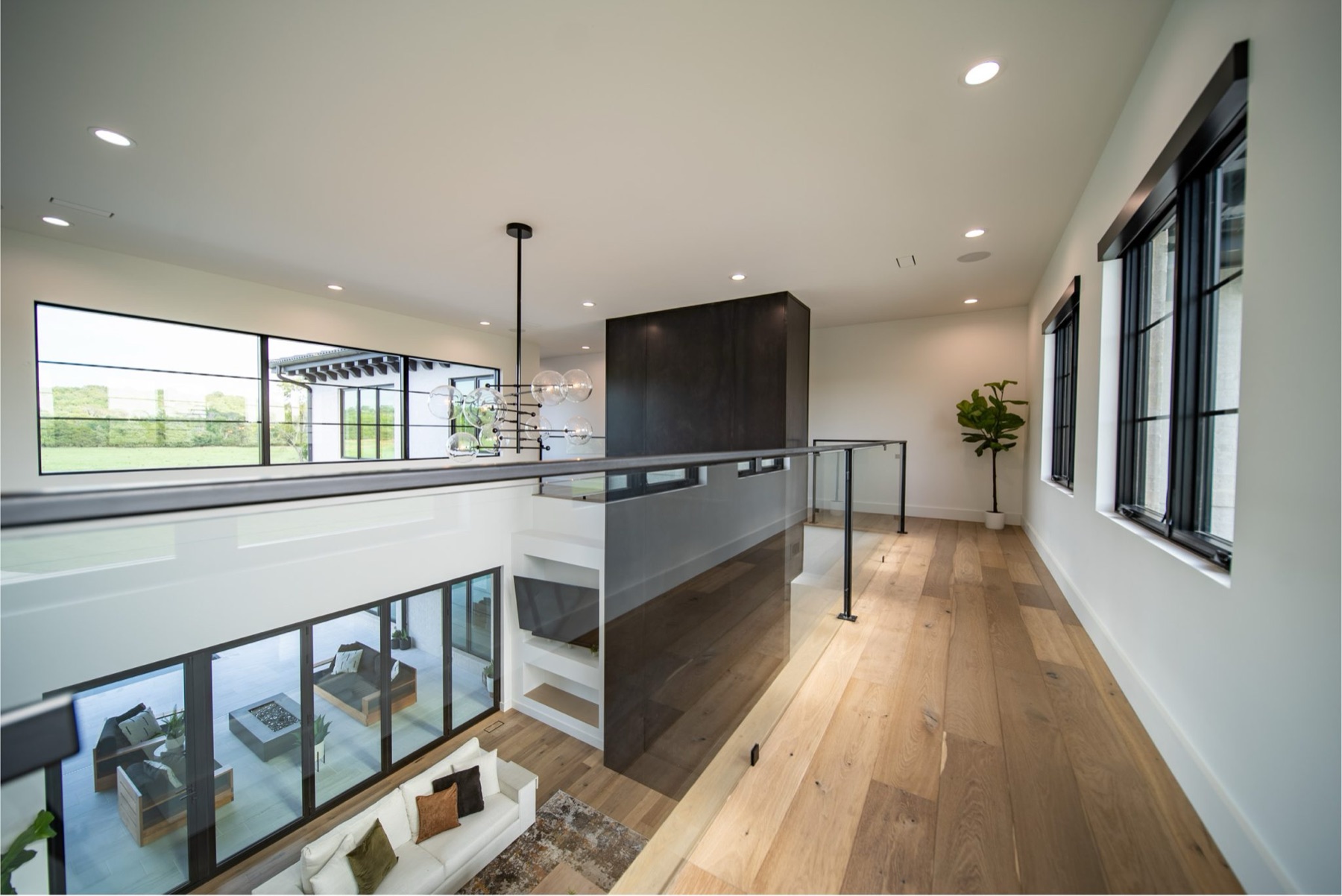 Modern custom home interior with open loft walkway